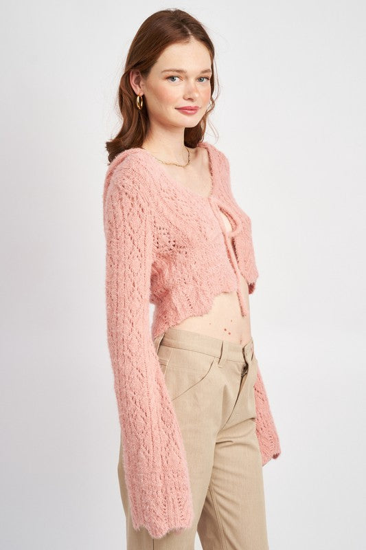 This top layers beautifully — wear over a bralette or slip for soft contrast.