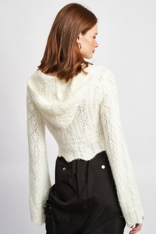 A standout piece — crochet craftsmanship meets flattering shape and flow.