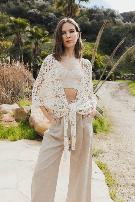 Open-front kimono with crochet floral petal details for a soft boho vibe.