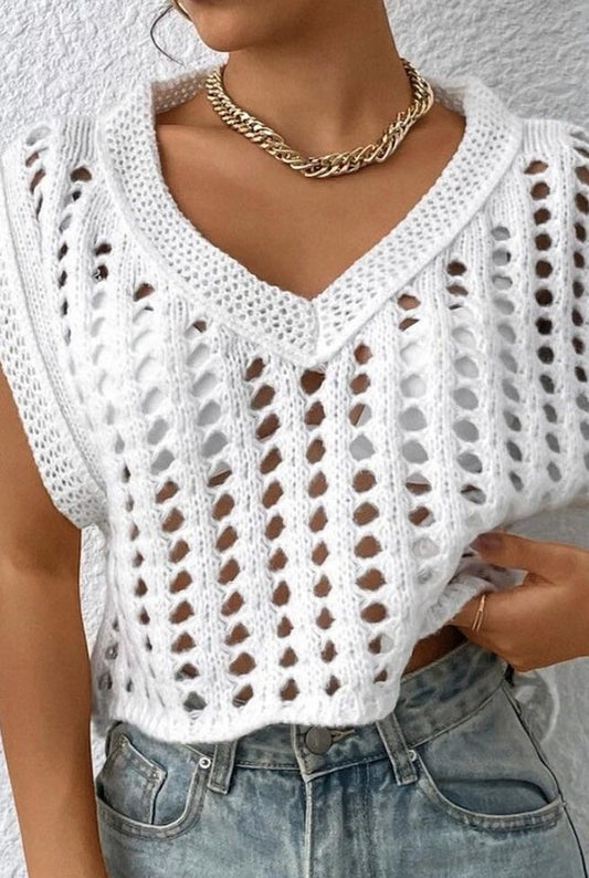 Open-knit crochet texture in a sleeveless vest — perfect for layering.