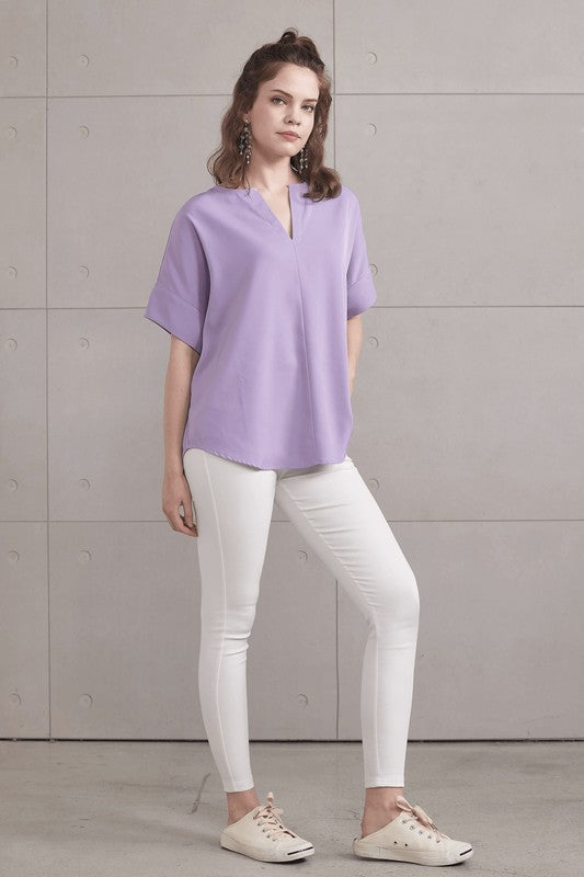 Dolman short sleeves offer relaxed comfort and ease of movement.