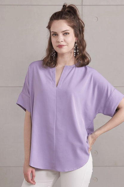 Soft V-neckline creates a flattering and open neckline.