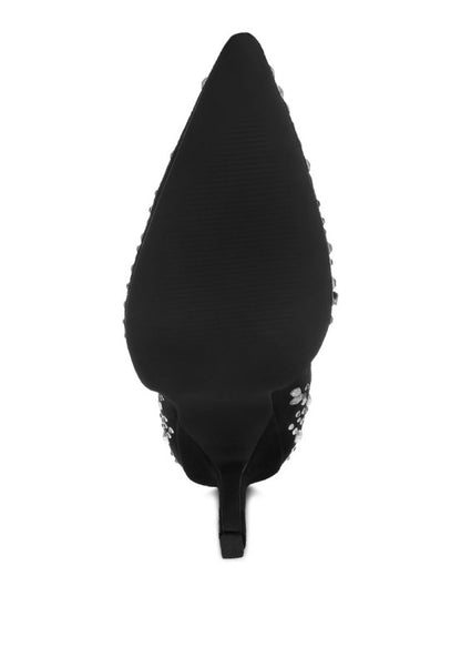 Black pointed-toe high heel sole on a white background