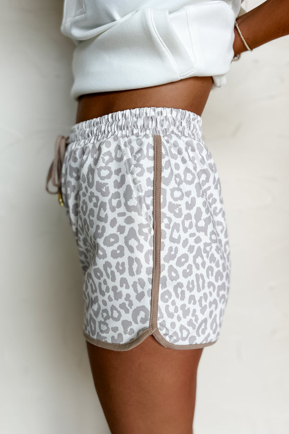 Unleash your wild side. These leopard-inspired shorts combine fierce style with laid-back comfort. Featuring a stretchy waistband, lace-up front, and bold contrast trim, they’re perfect for turning heads while keeping it casual.