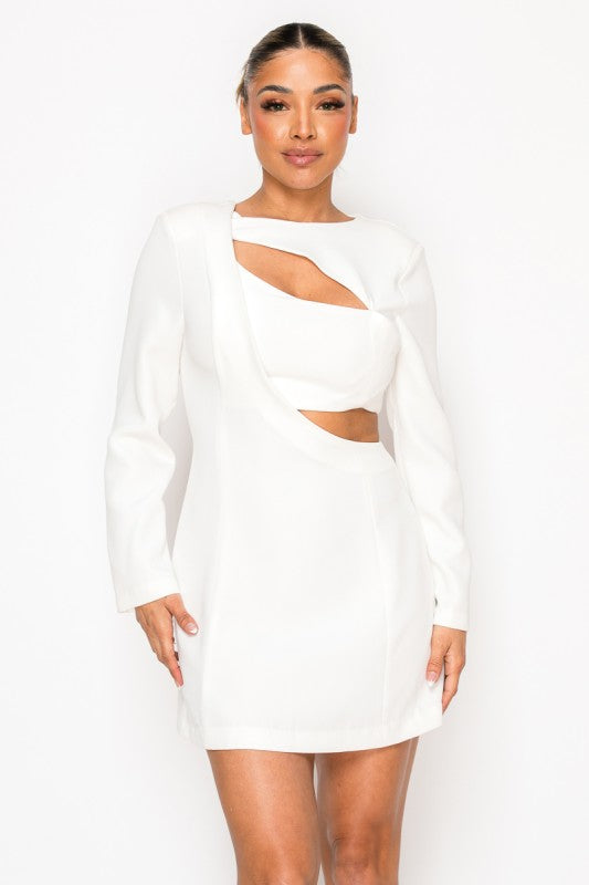 Woman wearing a long-sleeve mini dress with asymmetrical cutouts across the chest and midriff, styled against a plain white background.