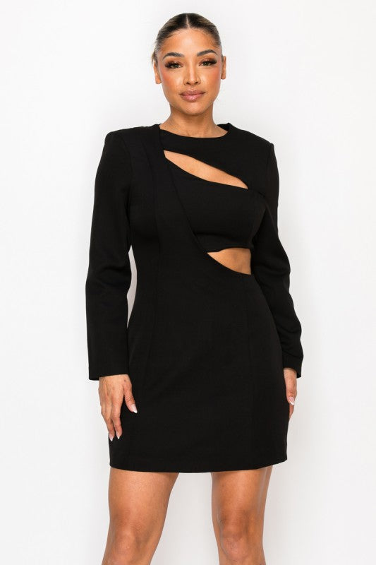 Woman wearing a long-sleeve mini dress with asymmetrical cutouts across the chest and midriff, styled against a plain white background.