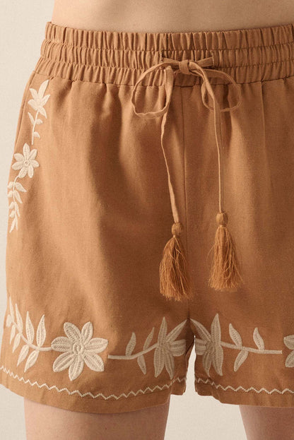 Khaki boho casual shorts with floral embroidery, tasseled drawstring, and elastic waistband for a comfy, chic summer look.