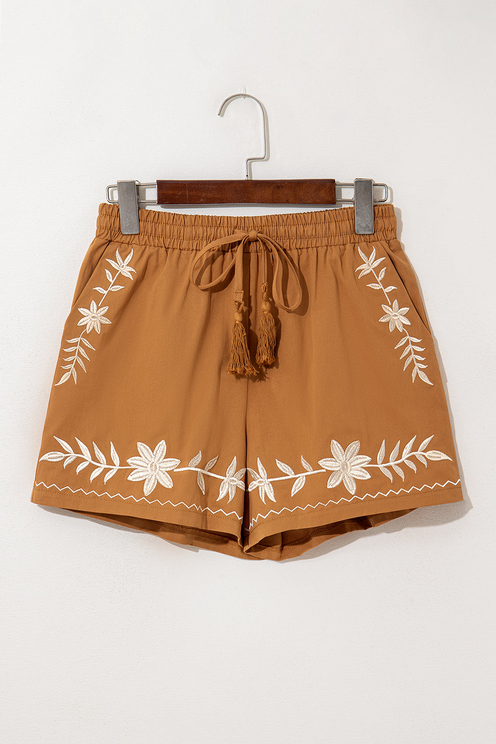 Khaki boho casual shorts with floral embroidery, tasseled drawstring, and elastic waistband for a comfy, chic summer look.
