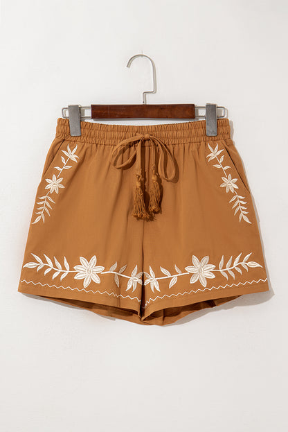 Khaki boho casual shorts with floral embroidery, tasseled drawstring, and elastic waistband for a comfy, chic summer look.