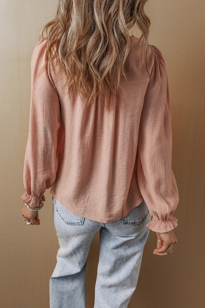 Flounce sleeves deliver a feminine silhouette with a graceful flutter. 