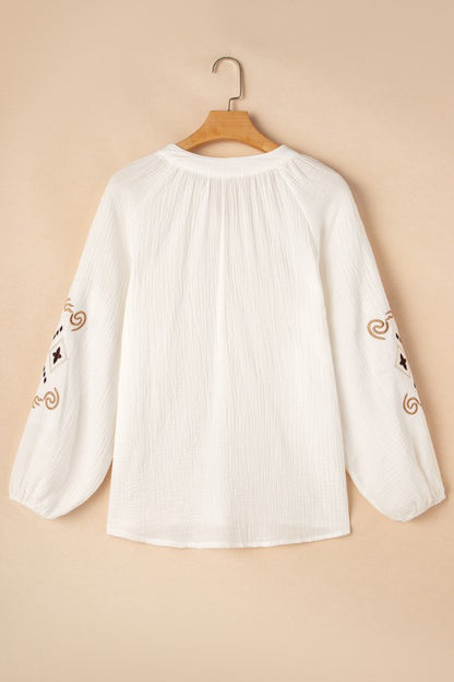 Delicate embroidery highlights intricate detail.