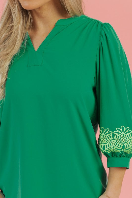Notched V-neckline creates a flattering shape.