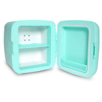Open turquoise mini fridge with white interior, featuring a removable shelf and molded door storage—placed on a wooden surface.