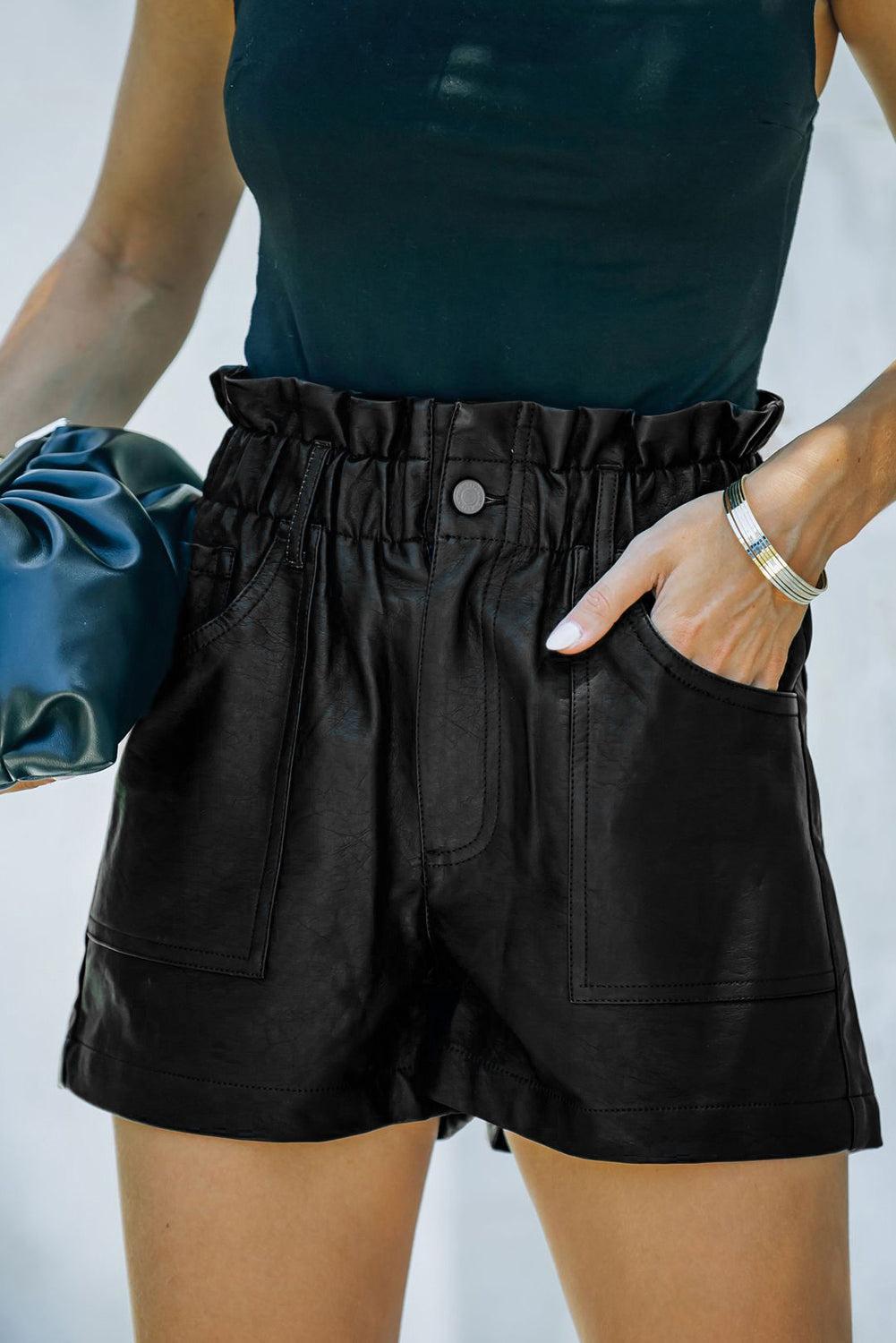 Sleek. Structured. Statement-making. These faux leather shorts bring high fashion to everyday wear with a flattering paperbag waist and a bold silhouette. Whether you're dressing up or keeping it casual, they’re your shortcut to instant edge.