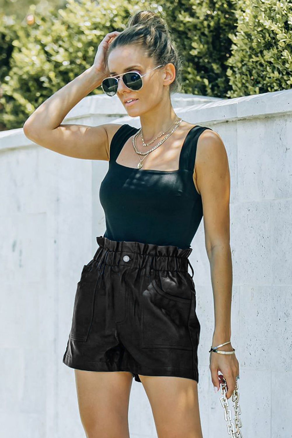 Sleek. Structured. Statement-making. These faux leather shorts bring high fashion to everyday wear with a flattering paperbag waist and a bold silhouette. Whether you're dressing up or keeping it casual, they’re your shortcut to instant edge.