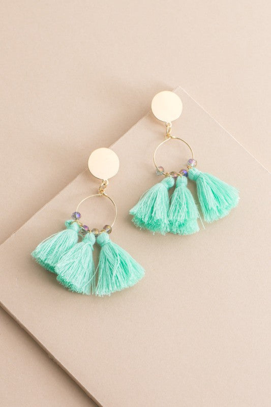 Fresh color. Flirty movement. These Flirty Tassel Earrings in Mint Green are designed to dance with every step. Featuring silky threads in a breezy hue, they’re perfect for brunch dates, beach days, or anytime you want to add a playful pop to your look.