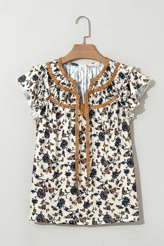 Frilly ruffles enhance the feminine charm.