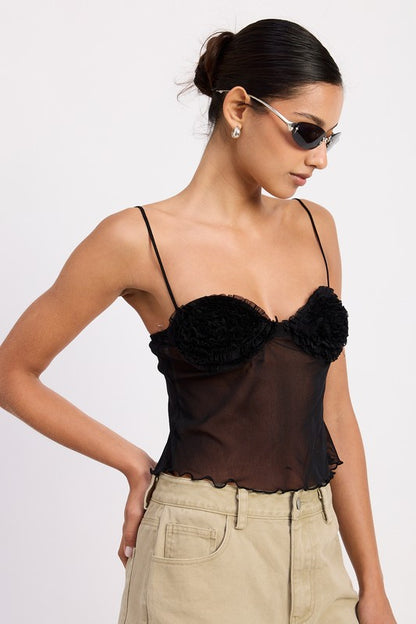 Cropped length — hits above the waist for high-rise bottoms. 