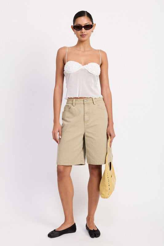 A striking piece when paired with high-waist jeans, skirts, or shorts.