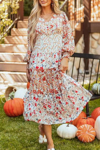 Floral midi dress with V-neckline, ruffle long sleeves, and tiered hem—ideal for spring events and casual outings