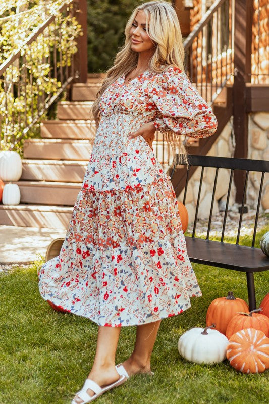 Floral midi dress with V-neckline, ruffle long sleeves, and tiered hem—ideal for spring events and casual outings