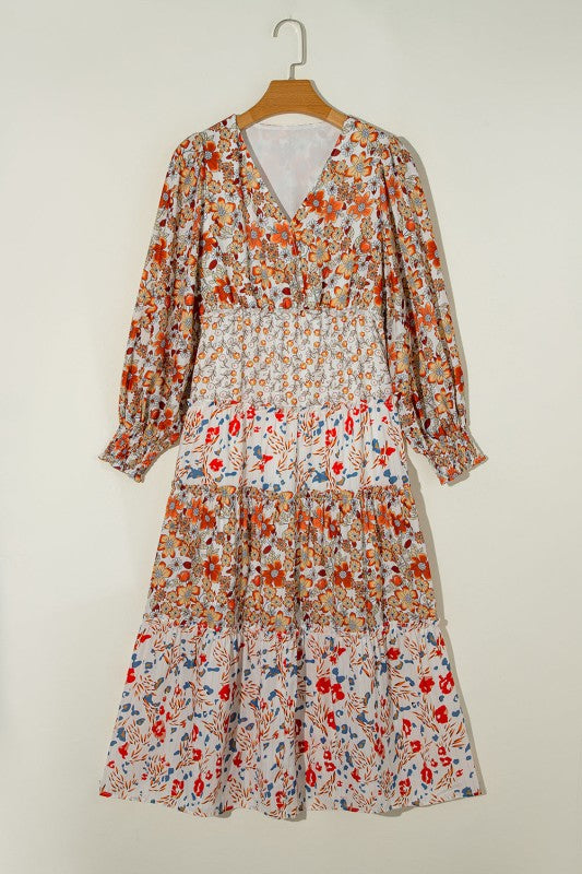 Floral midi dress with V-neckline, ruffle long sleeves, and tiered hem—ideal for spring events and casual outings