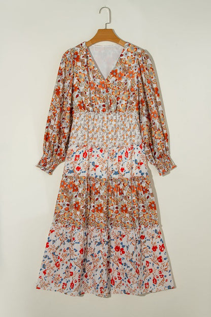 Floral midi dress with V-neckline, ruffle long sleeves, and tiered hem—ideal for spring events and casual outings