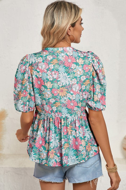 Puff sleeves add volume and a playful touch to the silhouette.