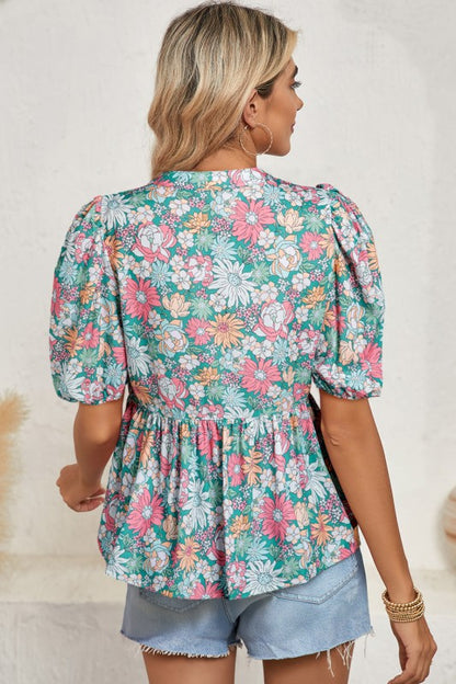 Puff sleeves add volume and a playful touch to the silhouette.