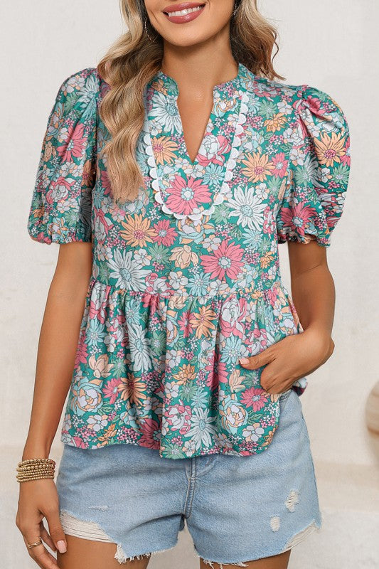 Floral print design gives this blouse a soft, romantic appeal.