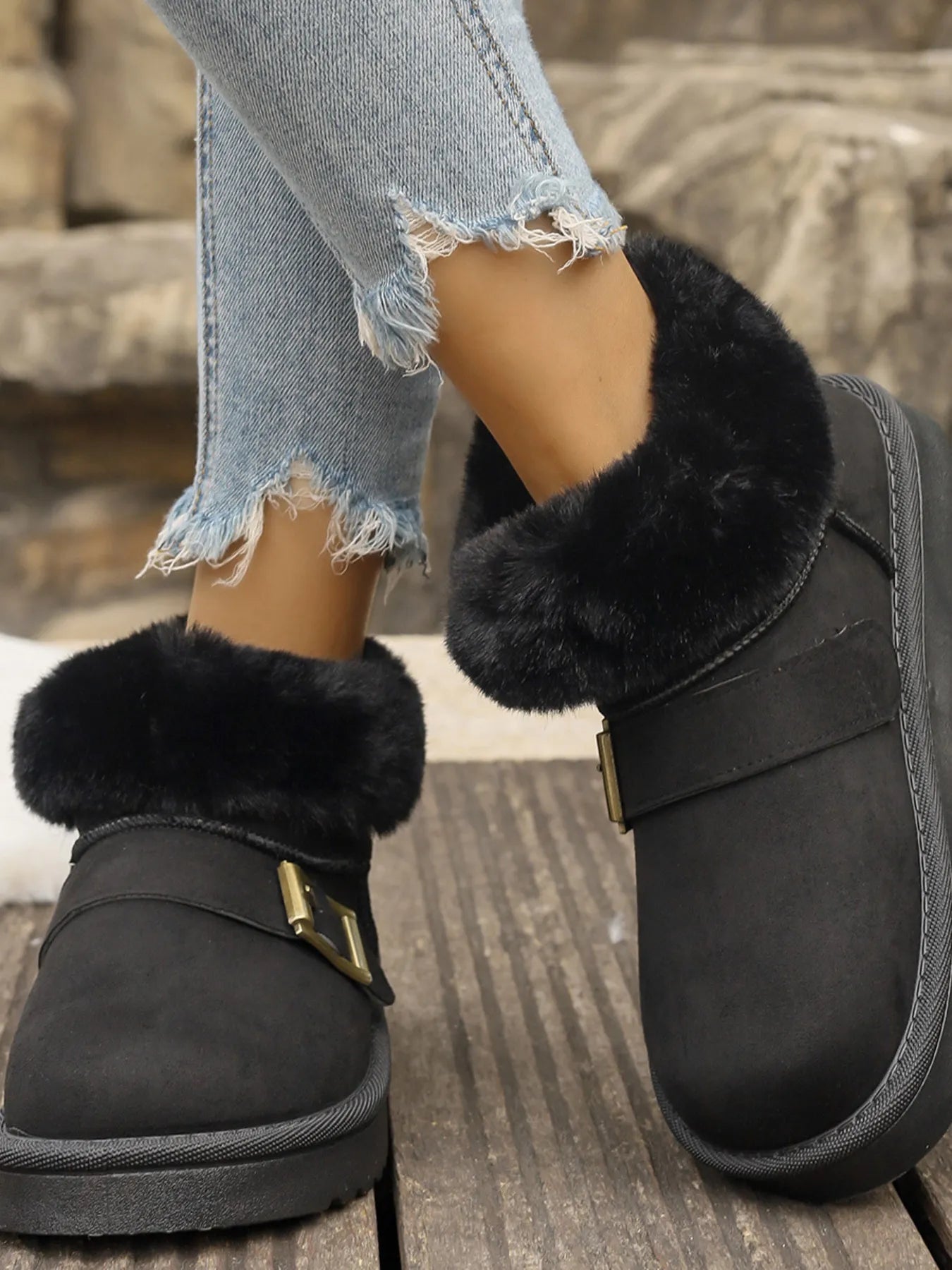 Ankle boots with faux fur trim, side buckle detail, platform sole, and slip-on design shown in multiple shades