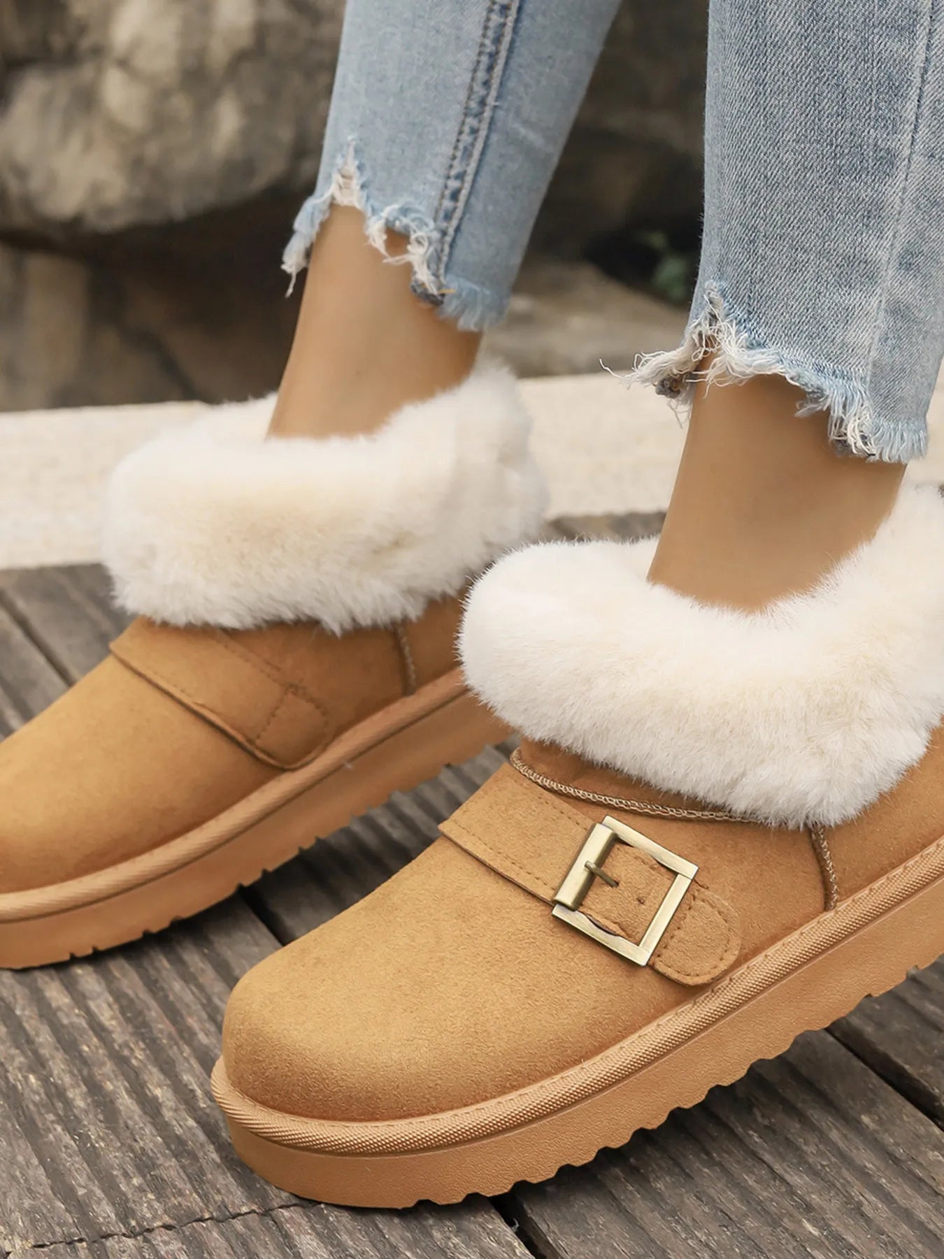 Ankle boots with faux fur trim, side buckle detail, platform sole, and slip-on design shown in multiple shades