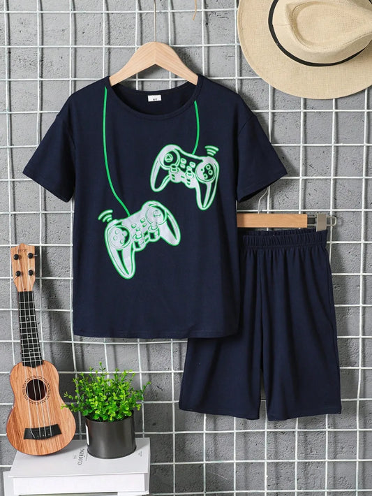 Navy blue t-shirt with green graphics and shorts on a hanger against a tiled wall.