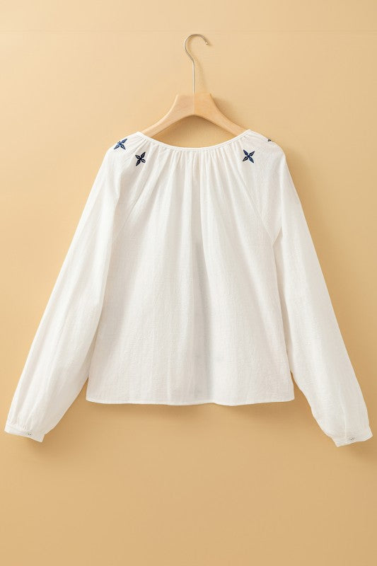 Full-length sleeves provide coverage and comfort, perfect for cooler settings. 