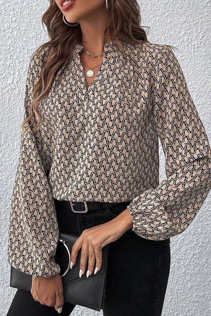 Geometric print adds modern flair paired with a notched V-neck for a flattering finish.