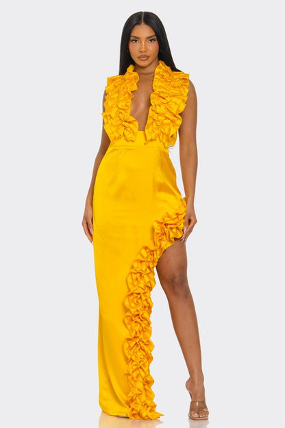 A bright yellow, one-shoulder dress with ruffle detailing along the neckline and a high side slit.