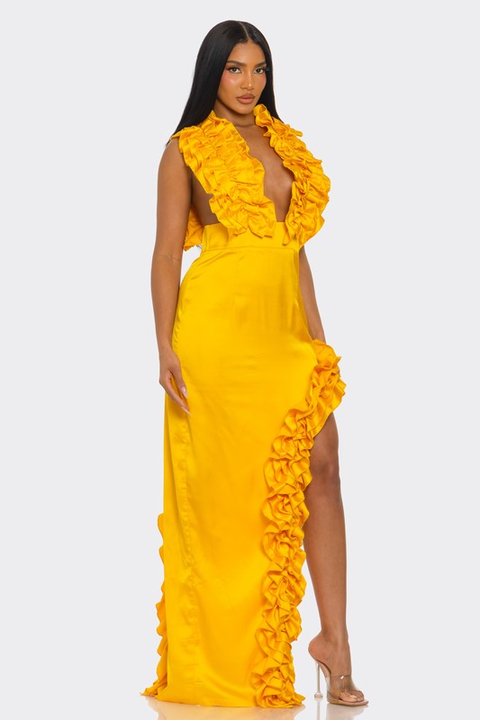 A bright yellow, one-shoulder dress with ruffle detailing along the neckline and a high side slit.