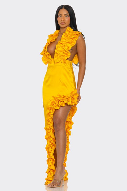 A bright yellow, one-shoulder dress with ruffle detailing along the neckline and a high side slit.