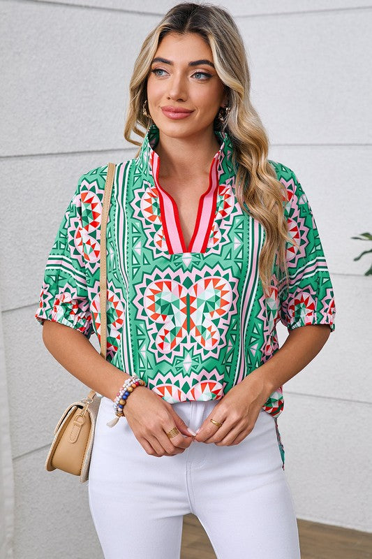 Relaxed, straight hem that hits around the hip — pairs well with jeans or leggings. 