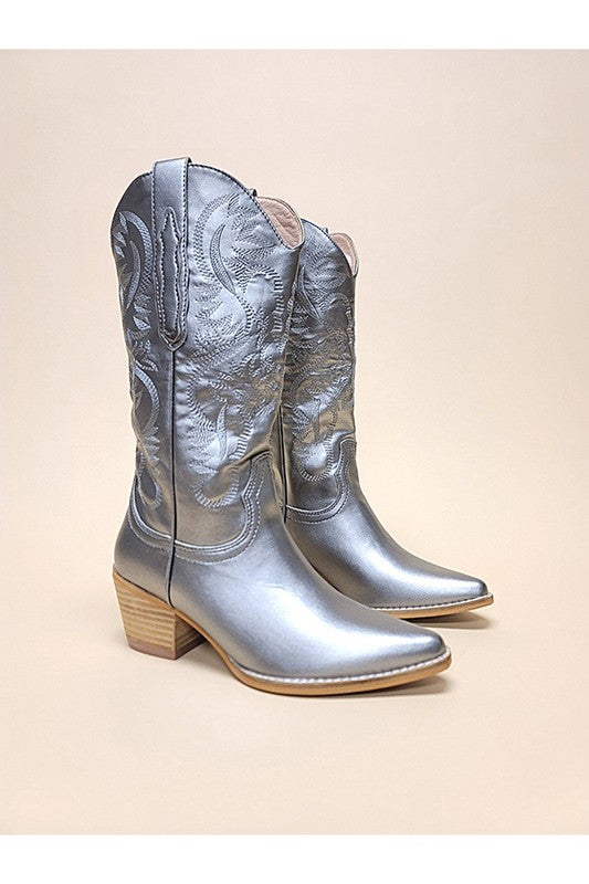 Western boots featuring decorative embroidery, pointed toe, block heel, and traditional pull tabs.