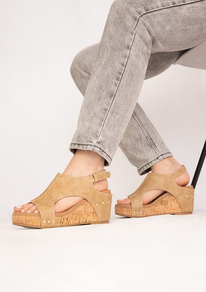 Platform wedge sandals with textured fabric upper, cutout design, ankle strap buckle, cork wedge heel, and open-toe style