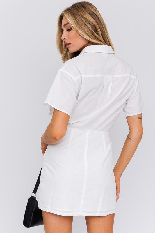 Half-sleeve shirt mini dress with collared neckline and button front, relaxed yet structured style ideal for daywear or casual outings