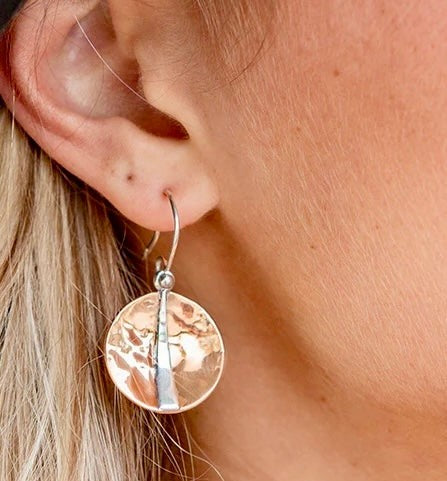 Raw texture. Refined shine. These handcrafted earrings blend the warmth of hammered copper with the cool elegance of sterling silver. Designed for lovers of artisan detail and bold simplicity, they’re perfect for everyday wear or special occasions.