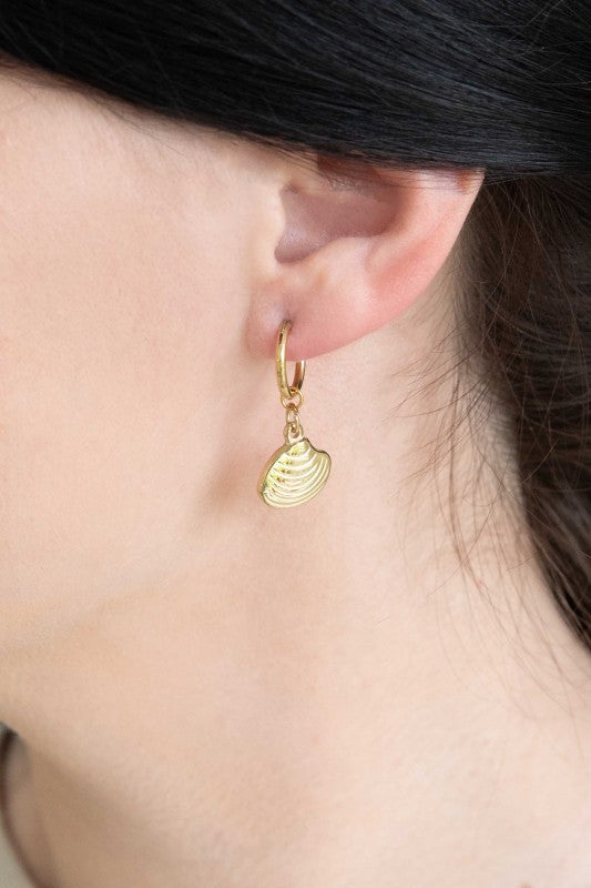 These Happy as a Clam Hoop Earrings feature removable clam shell pendants that swing from sleek hoops—giving you two styles in one. Whether you're channeling beach vibes or minimalist glam, these earrings are a playful nod to ocean-inspired beauty.
