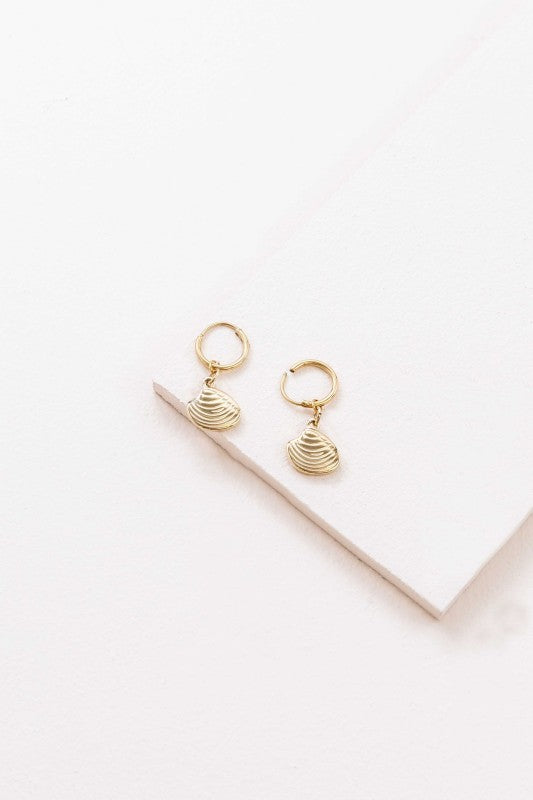 These Happy as a Clam Hoop Earrings feature removable clam shell pendants that swing from sleek hoops—giving you two styles in one. Whether you're channeling beach vibes or minimalist glam, these earrings are a playful nod to ocean-inspired beauty.
