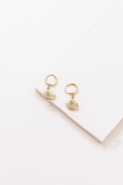 These Happy as a Clam Hoop Earrings feature removable clam shell pendants that swing from sleek hoops—giving you two styles in one. Whether you're channeling beach vibes or minimalist glam, these earrings are a playful nod to ocean-inspired beauty.