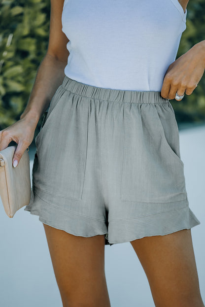 Sweet meets chic. These high-waisted ruffle shorts are the perfect blend of feminine charm and everyday comfort. With a flattering silhouette and practical pockets, they’re ready for brunch dates, beach strolls, or casual days out.