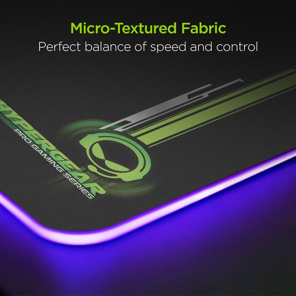 A flexible HYPERGEAR gaming mouse pad with RGB lighting and built-in wireless charging, featuring plug-and-play setup.