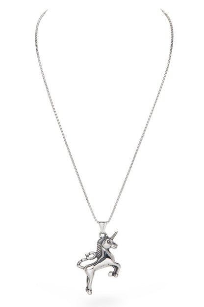 This image shows a silver unicorn pendant on a chain. The unicorn is posed on its hind legs with one front leg raised. It has a spiralled horn and a cut mane. The background is plain white.
