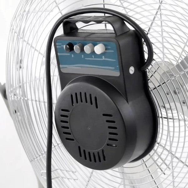 Metallic Impress floor fan with five blades and circular grille—mounted on a sturdy angled stand with rubber feet, designed for high-velocity cooling.